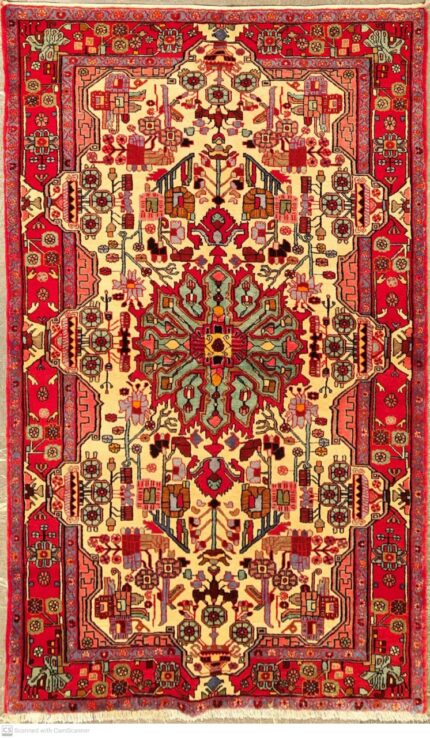 A hand-knotted Persian carpet from Nahavand,Iran, with geometric patterns in deep red and blue