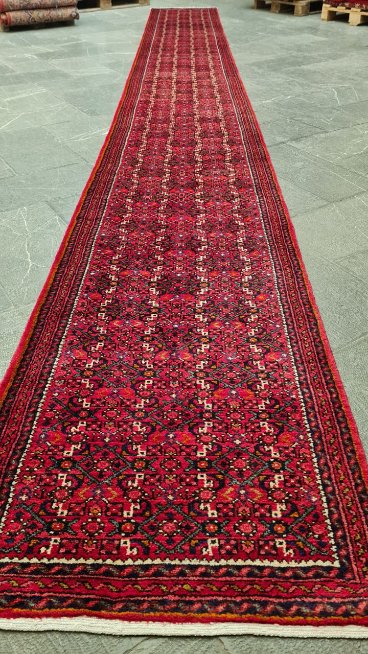 48588 Close-up of a traditional hand-knotted Persian Hamadan rug with geometric medallion design in deep red and blue
