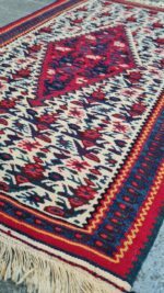 A vibrant,handwoven Sanandaj kilim with traditional Kurdish geometric patterns